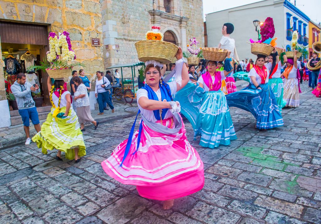 Women dancing on a day of the dead parade in Oaxaca Mexico